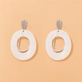 Chic white shell dangle earrings with silver-plated hooks, offering a modern touch to your jewelry collection.